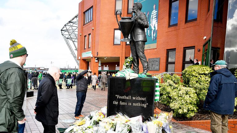 Celtic fans look at floral tributes to Tommy Gemmell before  a game on March 5. 