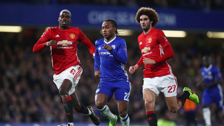 LONDON, ENGLAND - MARCH 13:  Willian of Chelsea is chased by Paul Pogba and Marouane Fellaini of Manchester United during The Emirates FA Cup Quarter-Final