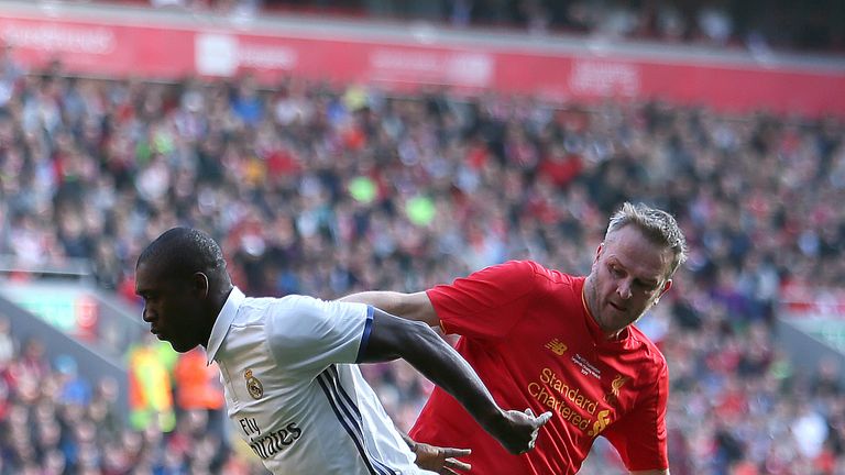 Real Madrid's Clarence Seedorf (left) and Liverpool's Didi Hamann (right) battle for the ball during the charity match at Anfield, Liverpool.