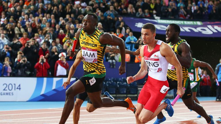 Usain Bolt competing in the 4x100m relay final at the 2014 Commonwealth Games