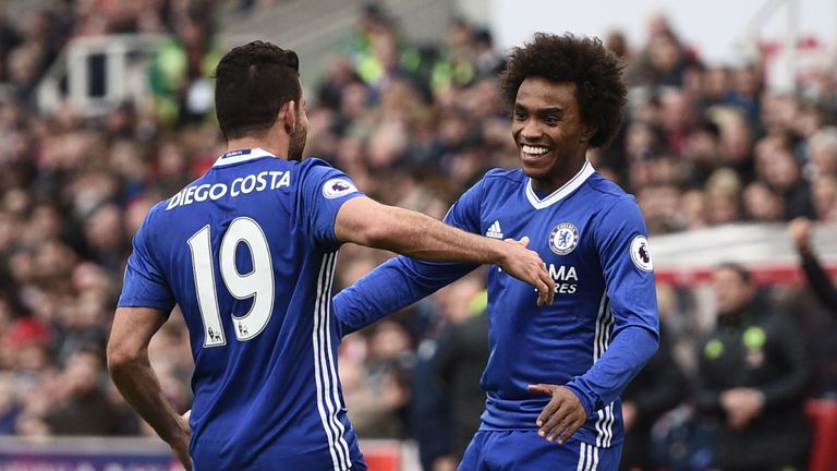 Chelsea's Brazilian midfielder Willian (R) celebrates with Chelsea's Brazilian-born Spanish striker Diego Costa after scoring during the English Premier Le