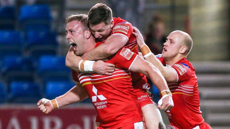 30/03/2017 -Salford Red Devils v St Helens - Salford's Craig Kopczak (L) celebrates his try with Kriss Brining (centre) and Michael Dobson (R).