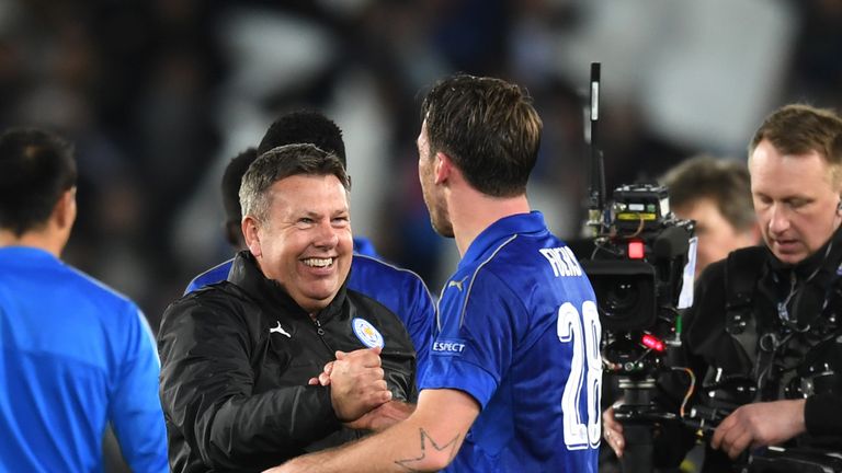 LEICESTER, ENGLAND - MARCH 14:  Craig Shakespeare the interim Manager of Leicester City and Christian Fuchs of Leicester City celebrate their team's 3-2 ag