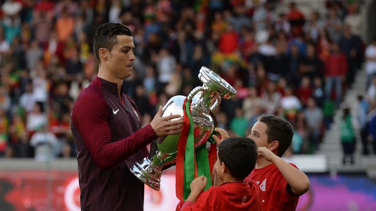 Cristiano Ronaldo shows off the European Championship trophy ahead of Portugal's friendly with Sweden in Madeira