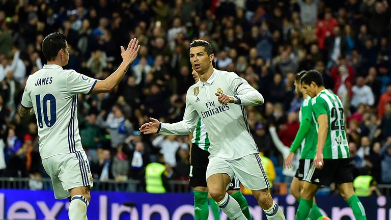 Real Madrid's Portuguese forward Cristiano Ronaldo (R) is congratulated by Real Madrid's Colombian midfielder James Rodriguez after scoring a goal during t