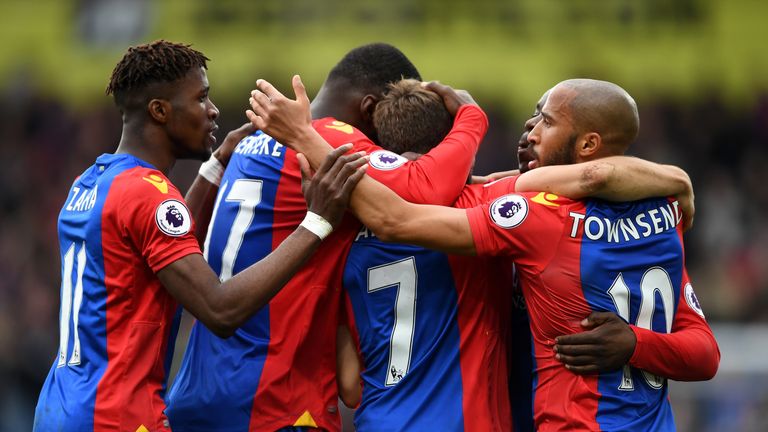 Yohan Cabaye of Crystal Palace celebrates with his team-mates after Troy Deeney of Watford (not pictured) scored a own goal, Premier League