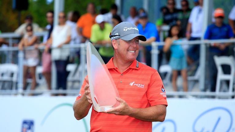 D.A. Points holds the trophy after winning the Puerto Rico Open 