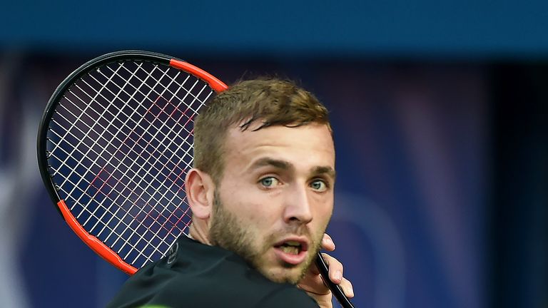 Dan Evans plays a backhand during his second round match against Gael Monfils at the Dubai Tennis Championships