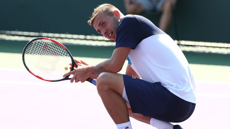 Dan Evans of Great Britain reacts during his match against  Ernesto Escobedo during day 3 of the Miami Open