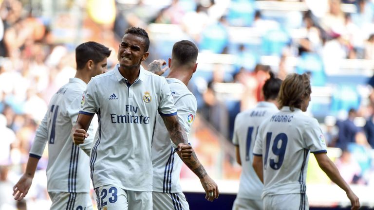 Real Madrid's Brazilian defender Danilo (L) celebrates after scoring during the Spanish league football match Real Madrid CF vs CA Osasuna at the Santiago 
