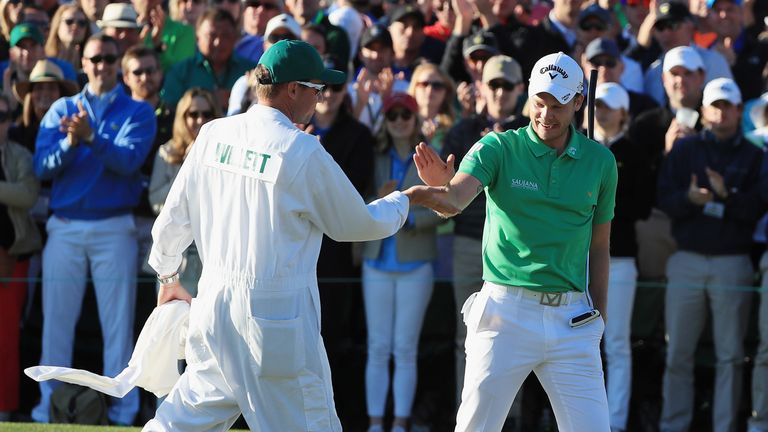 AUGUSTA, GA - APRIL 10:  Danny Willett of England celebrates with his caddie on the 18th green during the final round of the 2016 Masters Tournament at the