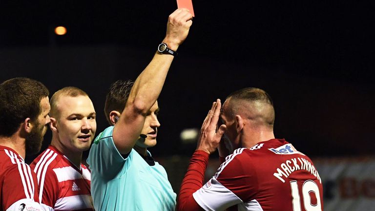Hamilton's Darian MacKinnon receives his red card against Aberdeen