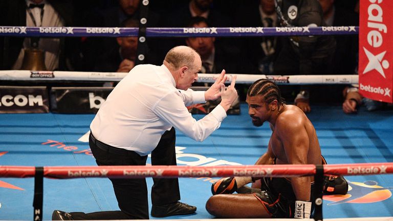 The referee counts over British boxer David Haye after he was knocked to the canvas by compatriot Tony Bellew 