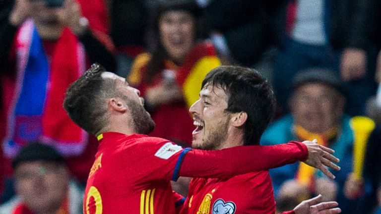 David Silva of Spain celebrates with his teammate Jordi Alba