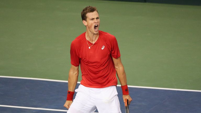 Vasek Pospisil of Canada celebrates a point during his singles match against Dan Evans of Great Britain