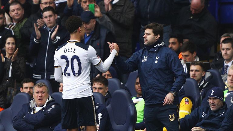 Dele Alli is congratulated by Mauricio Pochettino as he comes off shortly after scoring Tottenham's fourth goal