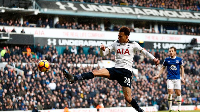 Tottenham Hotspur's English midfielder Dele Alli shoots to score their third goal during the English Premier League football match between Tottenham Hotspu