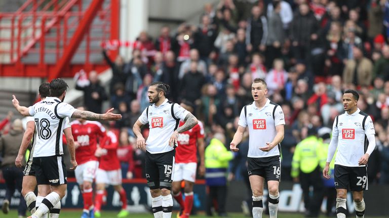 (left-right) Derby County's Bradley Johnson, Alex Pearce and Marcus Olsson look dejected after Nottingham Forest score their second goal of the game during