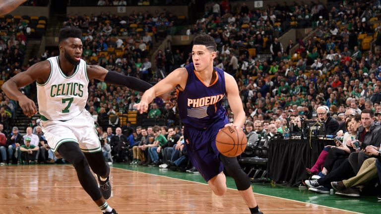BOSTON, MA - MARCH 24:  Devin Booker #1 of the Phoenix Suns goes to the basket against the Boston Celtics on March 24, 2017