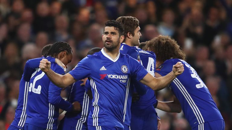 LONDON, ENGLAND - MARCH 13:  Diego Costa of Chelsea and team mates celebrate as N'Golo Kante of Chelsea (obscured) scores their first goal during The Emira