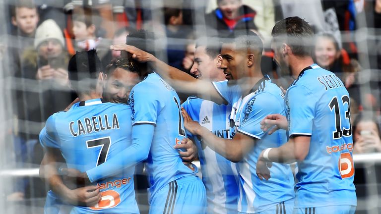  Marseille's French forward Dimitri Payet (2nd L) celebrates with teammates after scoring a goal during the French L1 football match between Lorient (FCL) 