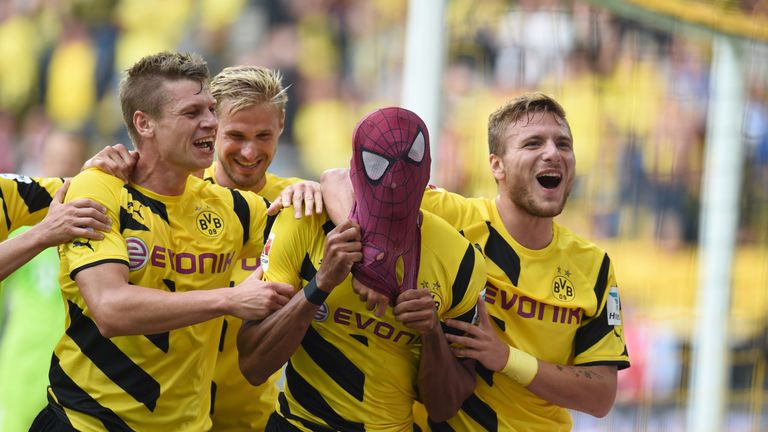 Dortmund's Italian striker Circo Immobile (R), Dortmund's Polish defender Lukasz Piszczek (L) celebrate after Dortmund's Gabonese striker Pierre-Emerick Au