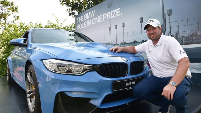Duncan Stewart with his prize for his superb hole-in-one at the Indian Open