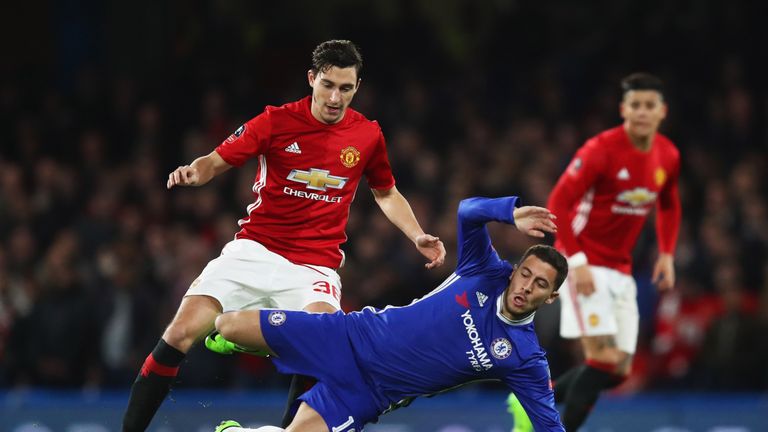 LONDON, ENGLAND - MARCH 13:  Eden Hazard of Chelsea is challenged by Matteo Darmian of Manchester United during The Emirates FA Cup Quarter-Final match bet