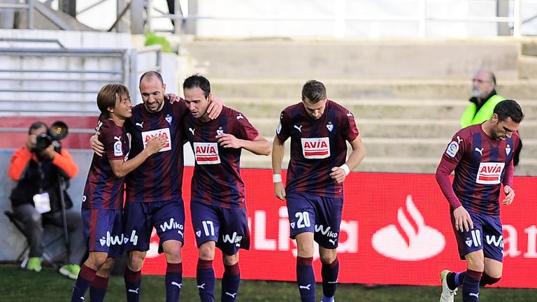 Eibar's defender Ivan Ramis (2nd L) celebrrates with teammates after scoring his team's first goal during the Spanish league football match between SD Eiba