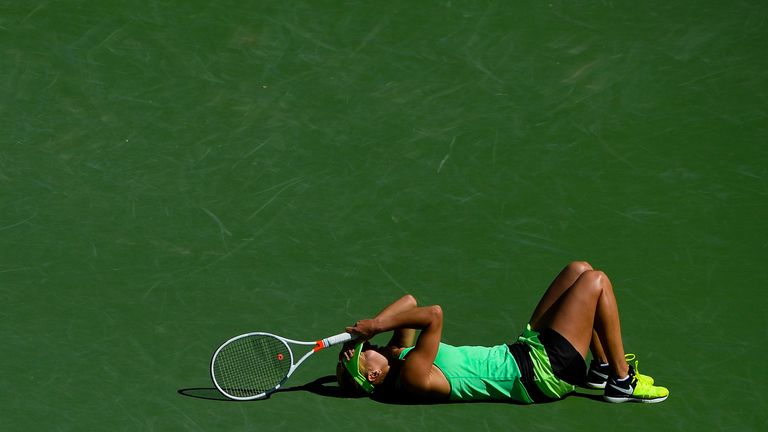 Vesnina drops to the floor after clinching the title