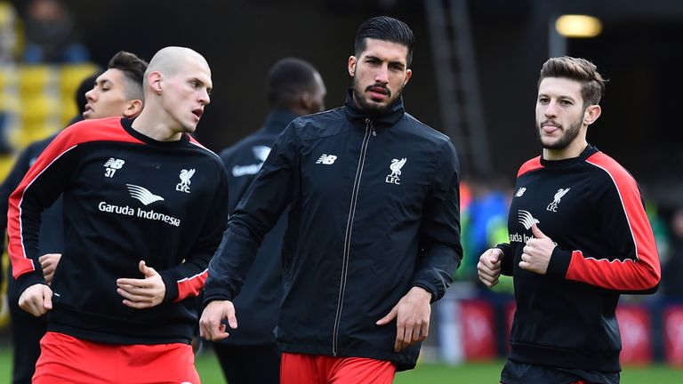 Liverpool's Slovakian defender Martin Skrtel (L), Liverpool's German midfielder Emre Can and Liverpool's English midfielder Adam Lallana (R) warm up ahead 