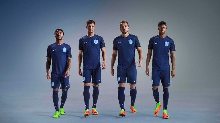 Raheem Sterling, John Stones, Harry Kane and Marcus Rashford model England's new navy away kit by Nike