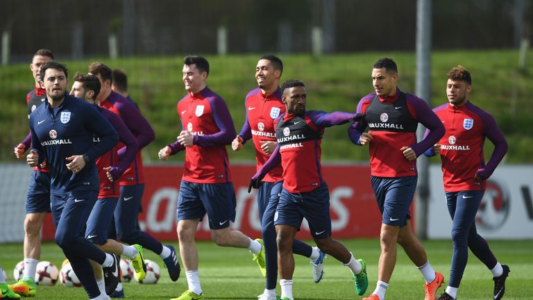 Jermain Defoe of England signals as he warms up with team-mates during an England training session at St Georges Park