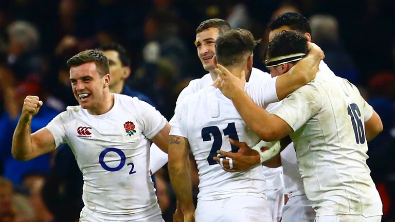 England's fly-half George Ford (L) celebrates England's win at the end of the Six Nations international rugby union match between Wales an