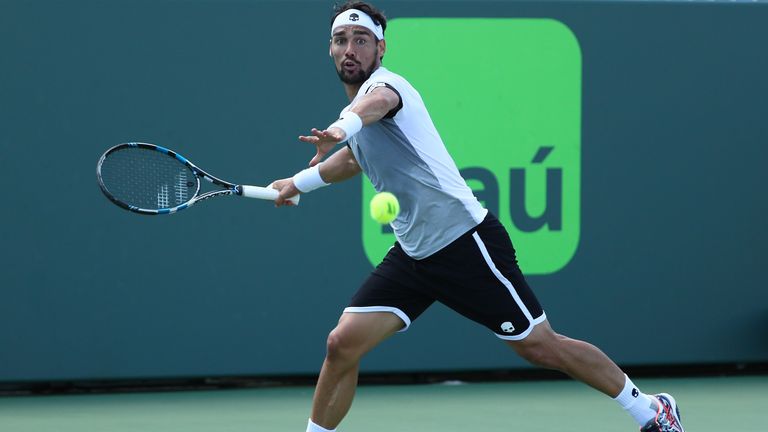 Fabio Fognini of Italy returns a shot against Donald Young during Day 9 of the Miami Open at Crandon Park Tennis Center on Ma