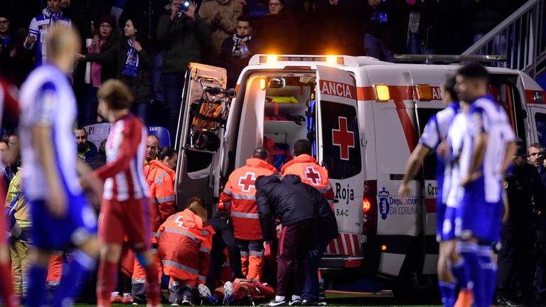Atletico Madrid's forward Fernando Torres is evacuated in an ambulance due to an injury during the Spanish league football match RC Deportivo de la Coruna 
