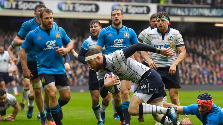 Finn Russell splits the Italy defence to score for Scotland 