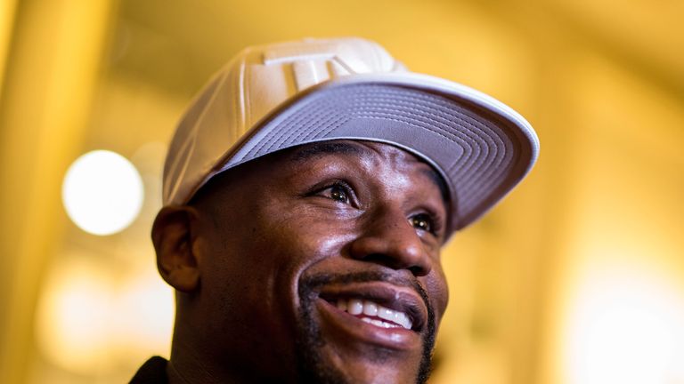 Floyd Mayweather Jr talks to the media after the press conference at the Savoy Hotel