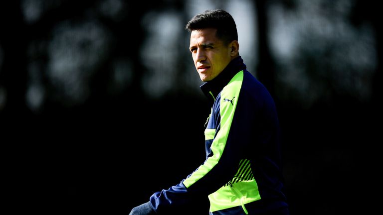 Alexis Sanchez arrives for training at London Colney