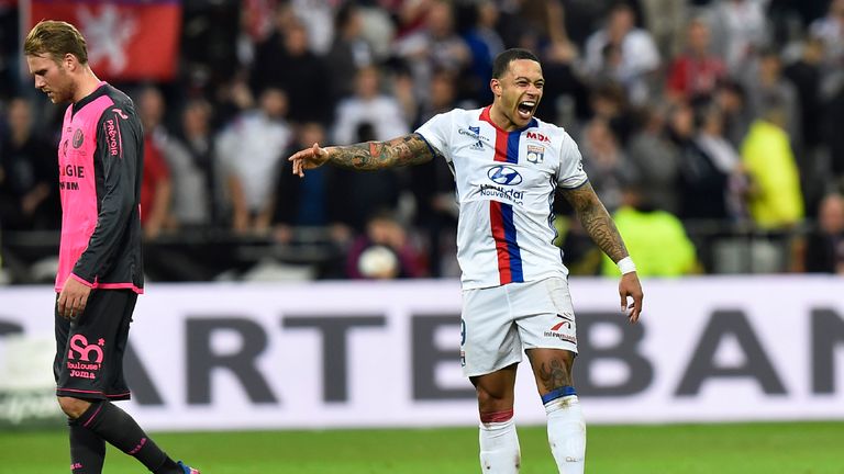 Memphis Depay celebrates after scoring an incredible halfway line goal against Toulouse