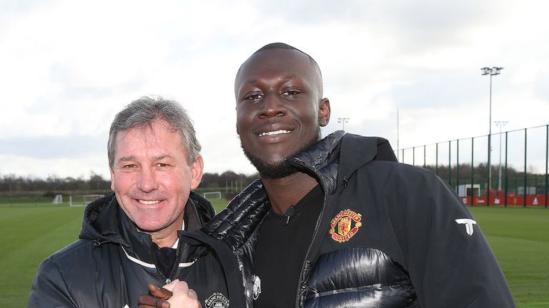 Bryan Robson meets UK grime artist Stormzy at the Aon Training Complex