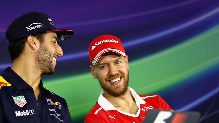 Sebastian Vettel talks to Daniel Ricciardo during the drivers press conference ahead of the Australian grand prix