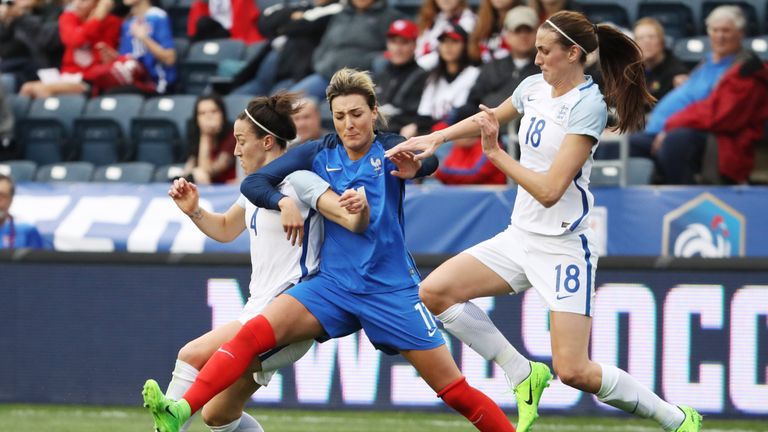 France's Claire Lavogez is swarmed by England's Lucy Bronze and Jill Scott as England and France women's national teams play in the SheBelieves Cup in Ches