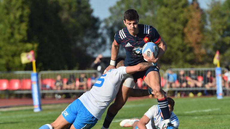 France's Romain N'Tamack (R) is tackled by Italy's Massimo Cioffi during the Under 20 Six Nations rugby union match between Italy and France at the Santa R