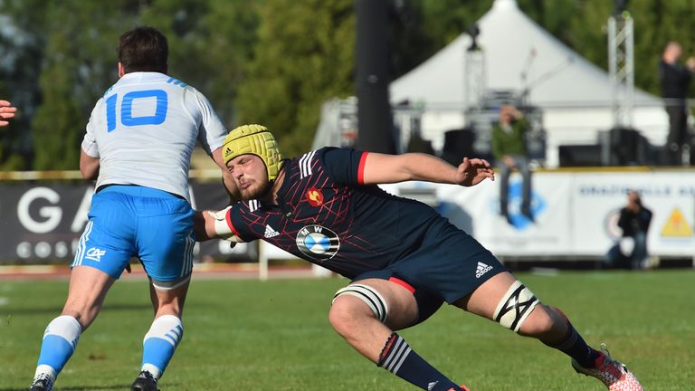 France's Mickael Capelli (R) tries to stop Italy's Antonio Rizzi during the Under 20 Six Nations rugby union match between Italy and France at the Santa Ro