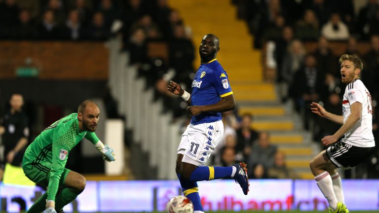 LONDON, ENGLAND - MARCH 07:  David Button of Fulham (L) and Souleymane Doukara of Leeds United (C) watch on as Tim Ream of Fulham (R) scores an own goal du