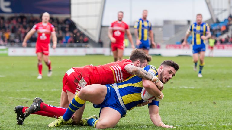 Salford's Gareth O'Brien can't prevent Declan Patton scoring a try for Warrington