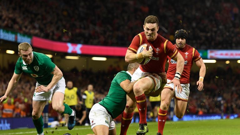 CARDIFF, WALES - MARCH 10:  George North of Wales beats the Ireland defence as he scores their first try during the Six Nations match between Wales and Ire