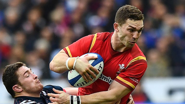 Wales' right wing George North (R) is tackled by France's flanker Fabien Sanconnie during the Six Nations tournament Rugby Union match between France and W