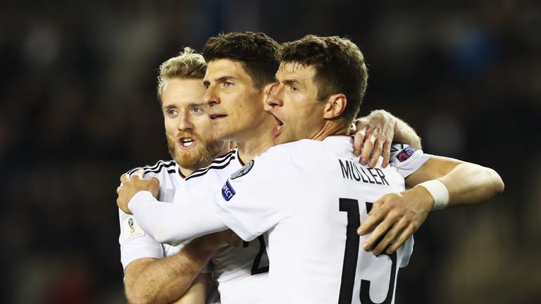 Andre Schurrle, Mario Gomez and Thomas Muller celebrate during Germany's World Cup Qualifier in Azerbaijan